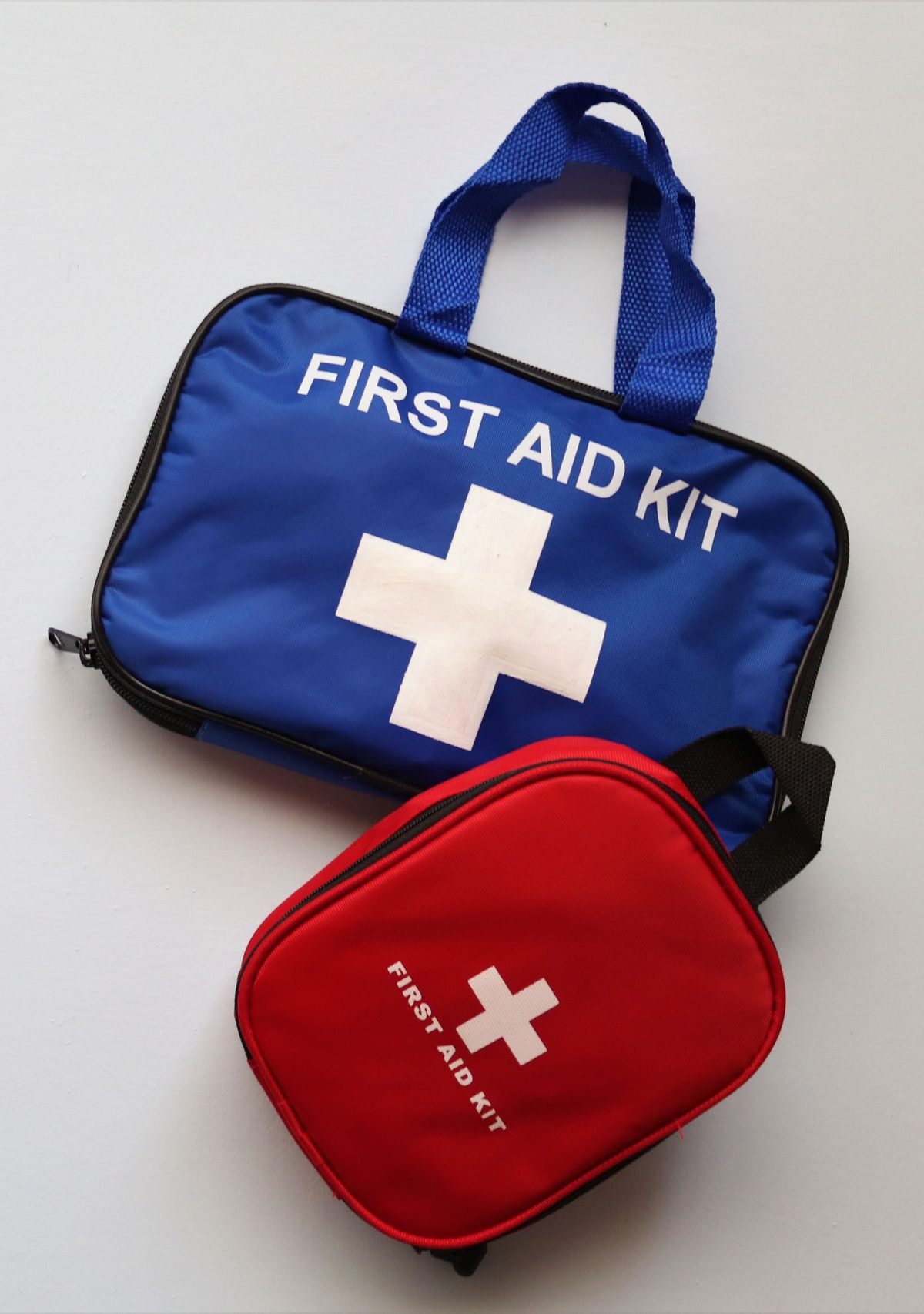 Two first aid kits on a white background with ample copy space.